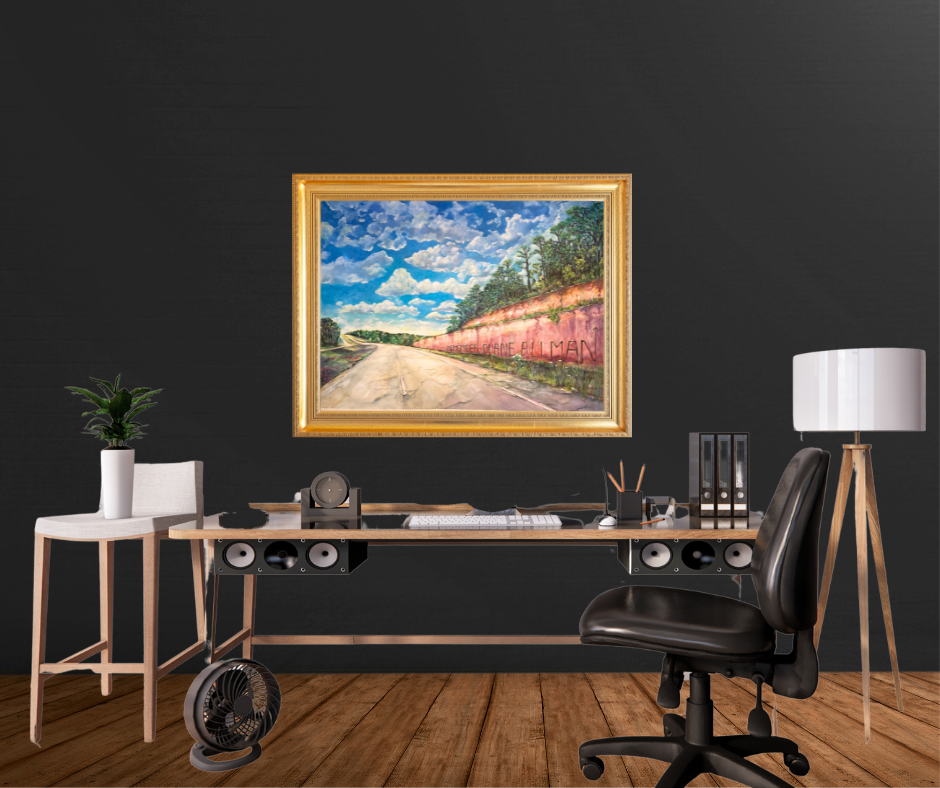 Modern office setup with a desk, chair, lamp, and a framed print on a dark wall.